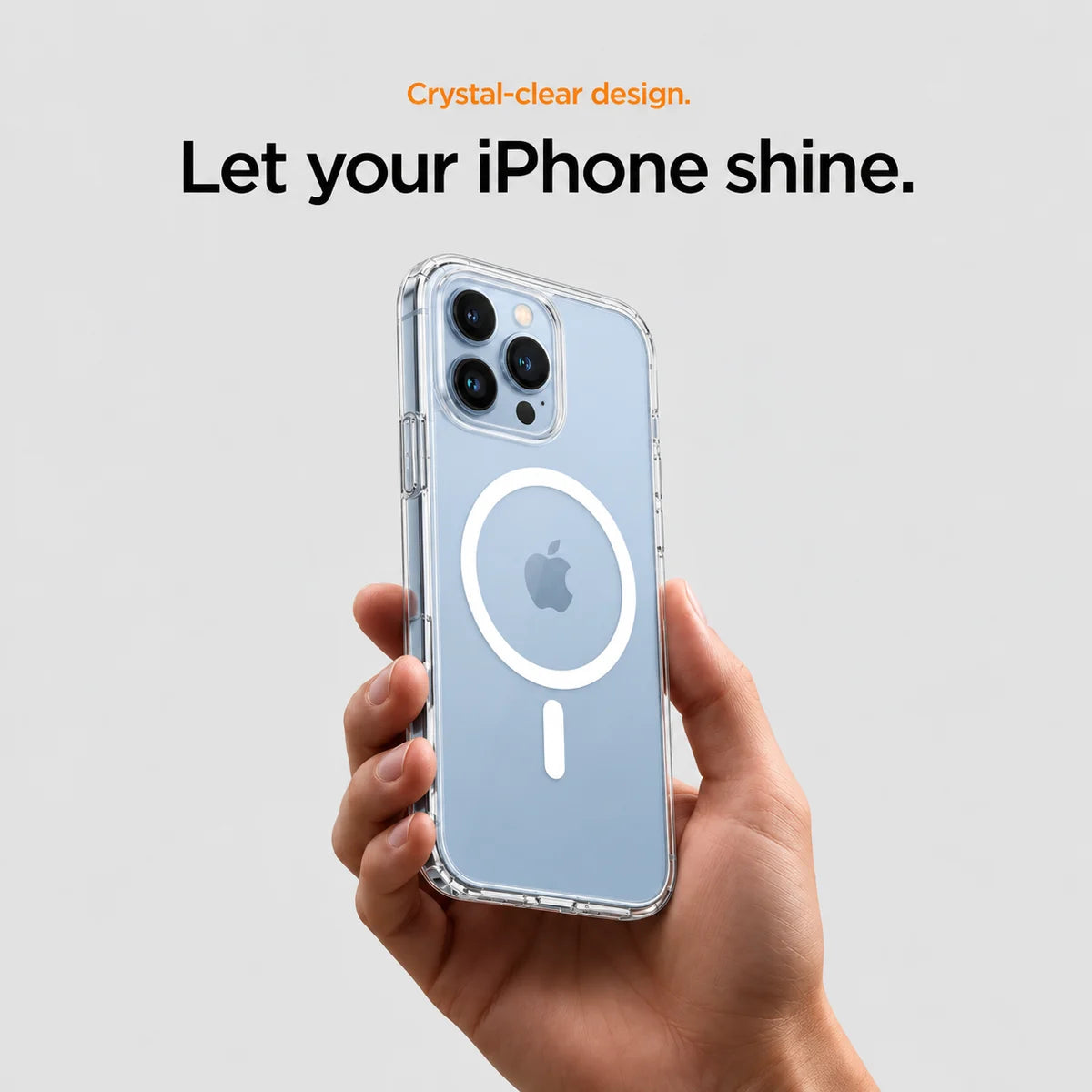 Clear magnetic phone case held at an angle, showing its transparent back and camera openings. #iPhone Model_iPhone 13 Pro Max