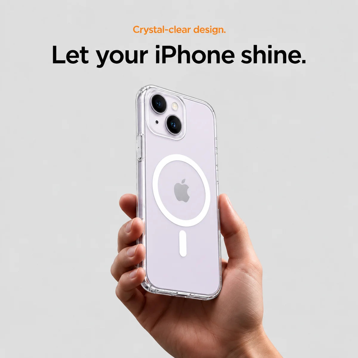 Clear magnetic phone case held at an angle, showing its transparent back and camera openings. #iPhone Model_iPhone 14 Plus