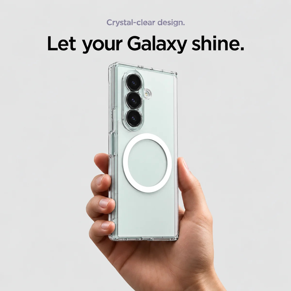 Clear magnetic phone case held at an angle, showing its transparent back and camera openings. #Samsung Model_Samsung Z Fold 7