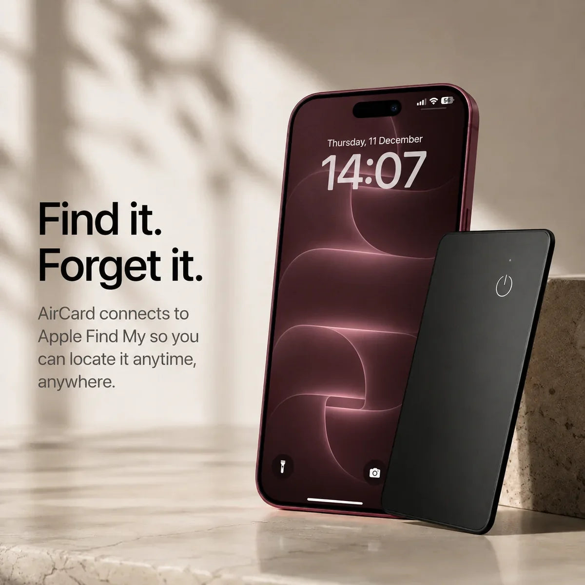 Black AirCard wallet tracker beside a Burgundy iPhone with matching wallpaper and lock screen.