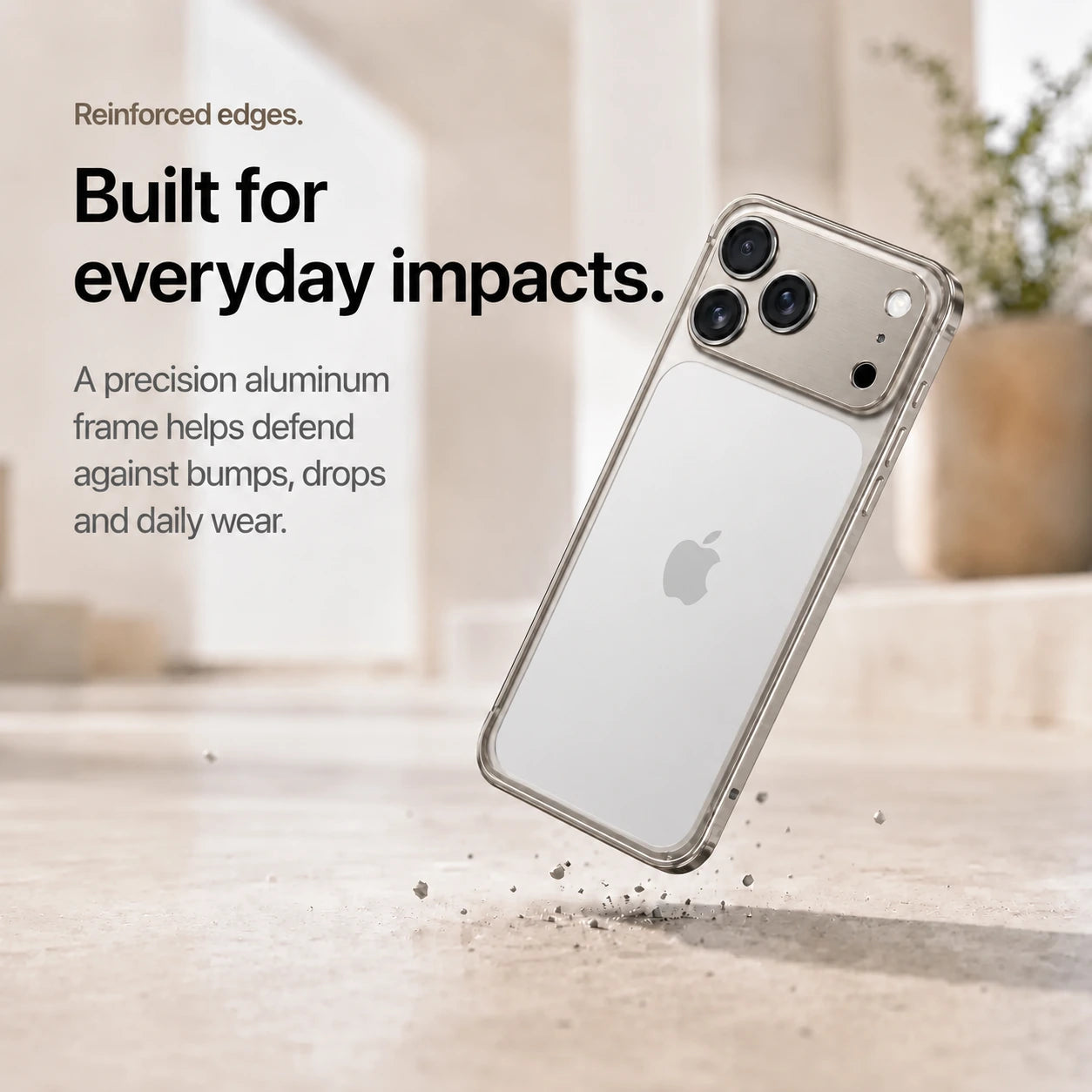 Warm gray aluminum frame phone case demonstrating its reinforced frame during a drop #color_Natural Titanium